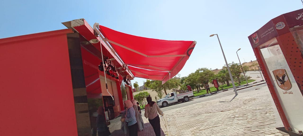 تركيب مظلات محلات متحركة 01555464501 16 مظلات محلات متحركة فرنساوي في النادي الاهلي