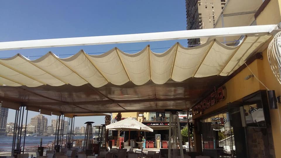 اشكال مظلات واجهات محلات والمطاعم 01555464501 22 اشكال مظلات مطاعم سحابة علي واير لون بيج مميز