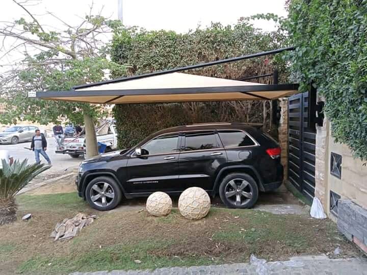 مظلات سيارات متحركة جاهزه 01555464501 13 تصاميم مظلات حديد مثبتة علي الحائط